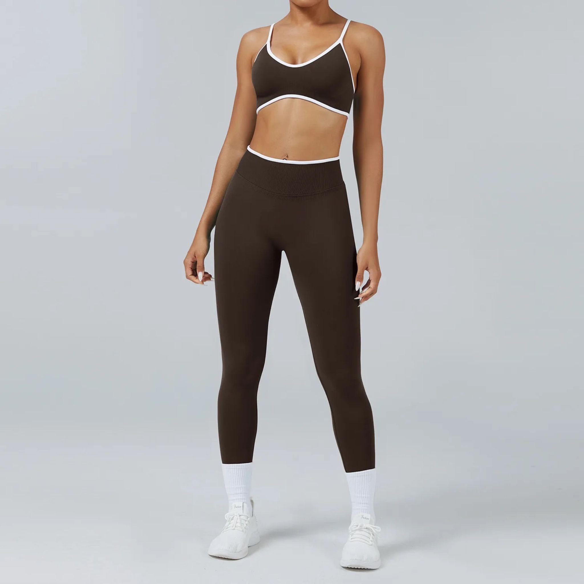 woman wearing a seamless workout set with white trim in brown