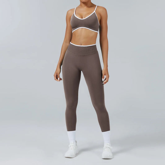 Person wearing a brown sports bra and leggings set on a gray background