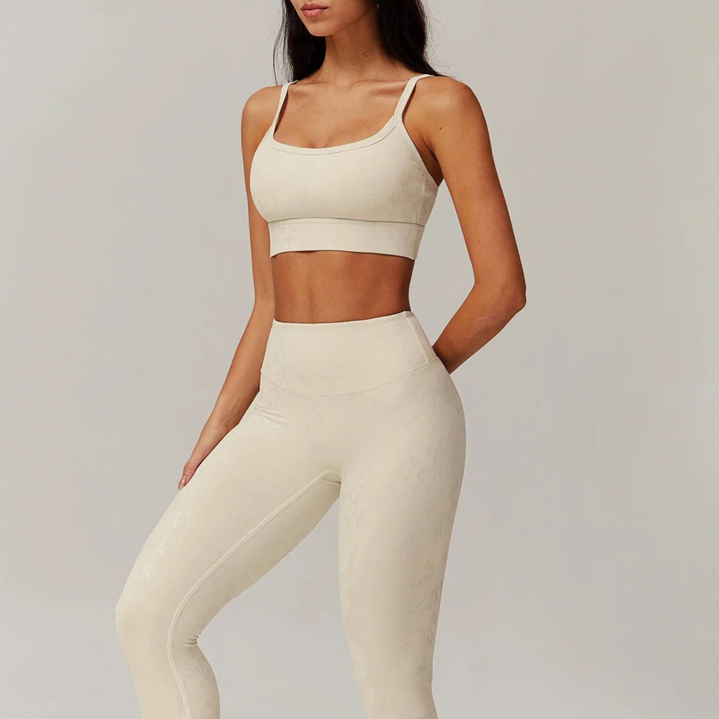 Neutral seamless sports bra by avvi in oat, minimal scoop design with light-to-medium support.